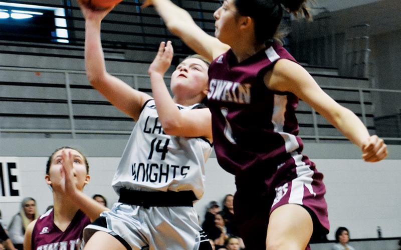 Chloe Adams (14) looks to outpace the Swain County defense during the second half of Dec. 16’s game. Photos by Kevin Hensley/sports@grahamstar.com