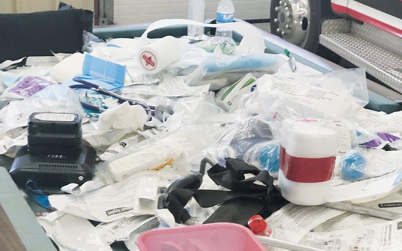 Discarded medical supplies are piled on the floor at the Graham County Emergency Services garage on Fort Hill Road. A whistle blower complaint alleges that some of the supplies were misidentified as being past their expiration date due to labels being misunderstood.