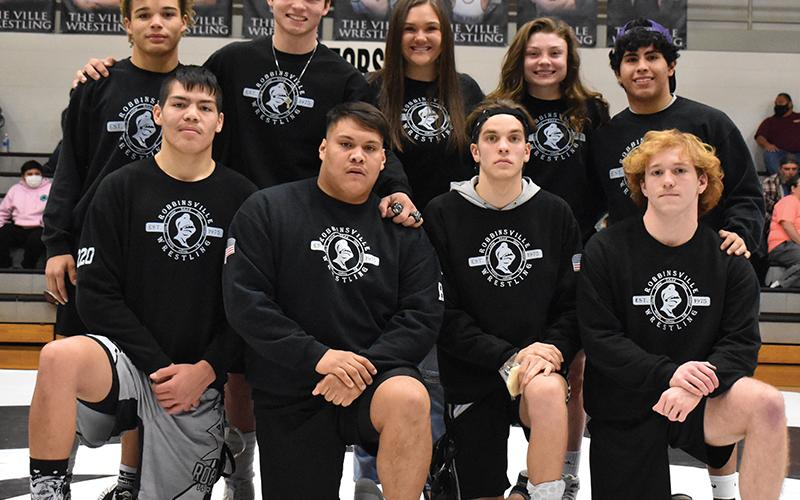 Prior to Tuesday’s dual against Cherokee, Robbinsville wrestling recognized its nine seniors. All names are listed from left. Kneeling: Ben Wachacha, Carlos Wesley, Zane Lucksavage and Jacob Hall. Standing: Jayden Nowell, Kyle Fink, manager Ivy Odom, Aynsley Fink and Jaret Panama. Photo by Kevin Hensley/sports@grahamstar.com