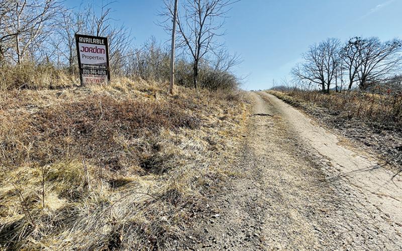 An “available” sign is still in place on a 32-acre parcel sold to the Eastern Band of Cherokee Indians by Randy Jordan and Warren Dudley Orr. The property is located between U.S. Highway 129 and Old U.S. Highway 129, with riverfront access on the Cheoah River. Photos by Randy Foster/news@grahamstar.com