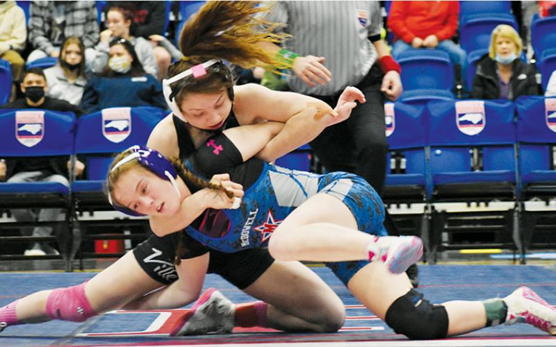 Aynsley Fink dictates control of McDowell’s Morgan Repasky during Saturday’s 107-pound state finals.