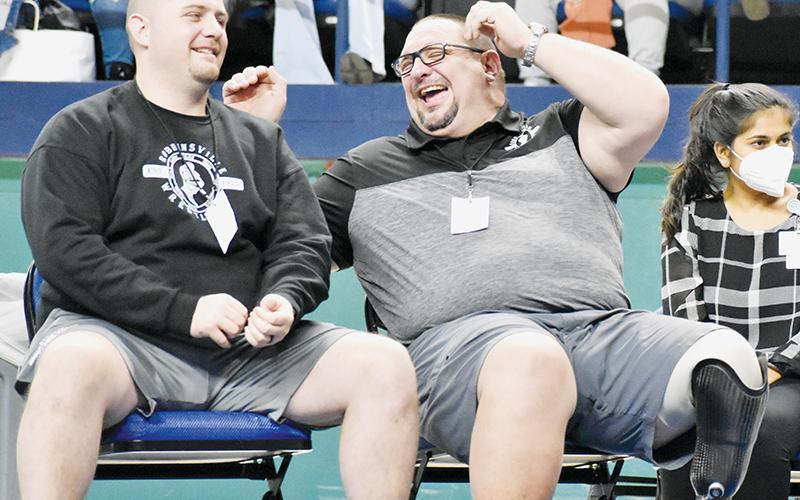Robbinsville wrestling head coach Todd Odom (right) shares a laugh with assistant Colby White at Saturday’s state individual tournament. After 21 years as a coach, Odom  announced his retirement from the sport Sunday. Photos by Kevin Hensley/sports@grahamstar.com
