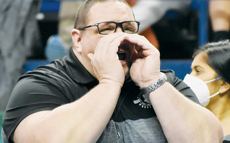 Black Knights head coach Todd Odom barks instructions during Saturday’s state finals.