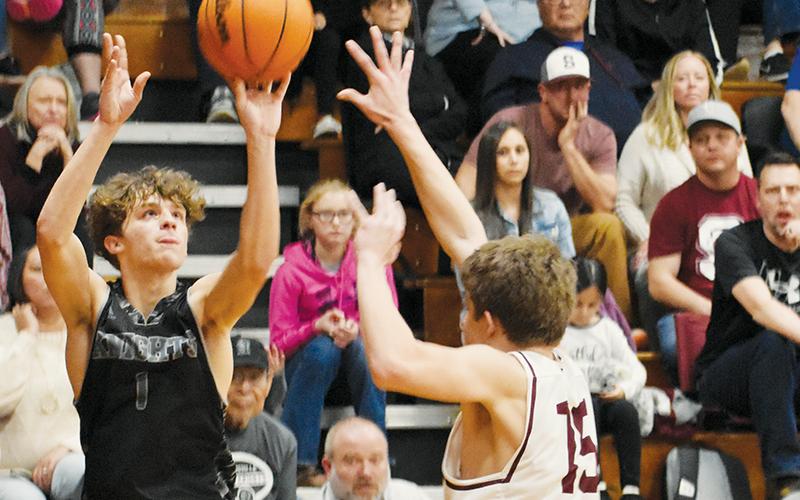 Robbinsville’s Kamdyn Jordan puts up a corner 3-pointer during the Feb. 15 Smoky Mountain Conference Tournament semifinals against Swain County. Photo by Kevin Hensley/sports@grahamstar.com