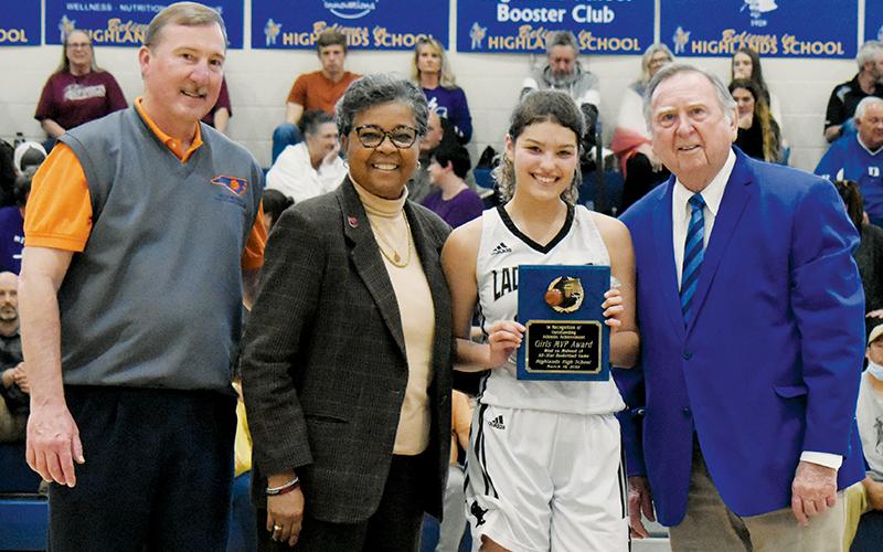 Robbinsville’s Yeika Jimenez was named the 1A West/Midwest Girls All-Star Game MVP, following her performance in Saturday’s exhibition at Highlands School. Presenting Jimenez with her award is (from left) Greg Grantham, executive director of the N.C. Basketball Coaches Association; Que Tucker, commissioner of the N.C. High School Athletic Association; and Dr. Bud Black, executive director of the 1A West/Midwest All-Star Games. Photos by Kevin Hensley/sports@grahamstar.com