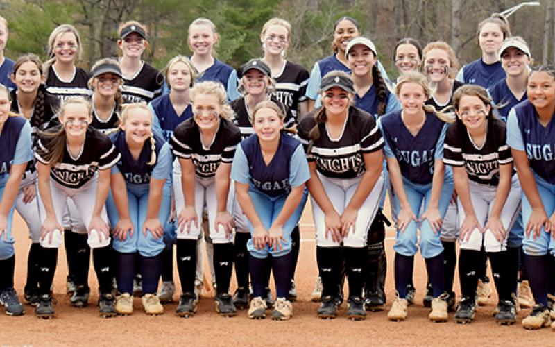 The Robbinsville Lady Knights and the Enka Sugar Jets gathered to commemorate the opportunity to play at the Catamount Softball Complex on Monday. Enka would prevail in six innings, 11-1. Photo by Kevin Hensley/sports@grahamstar.com