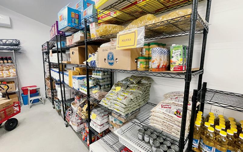 Shelves are stocked with food at Grace Place’s new pantry, which opened in February. Photos by Randy Foster/news@grahamstar.com