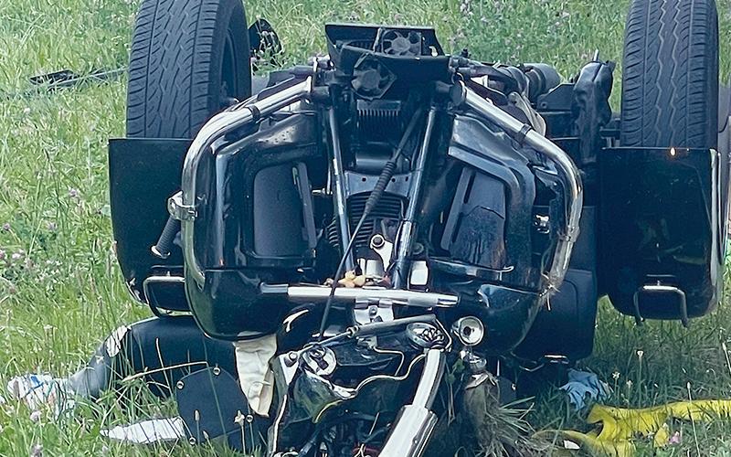Traffic was blocked in both directions just after 4 p.m. June 29, when a disabled three-wheel motorcycle being towed by a Good Samaritan rolled over on Sweetwater Road about two miles east of Rodney Orr Bypass. Photo by Randy Foster/news@grahamstar.com