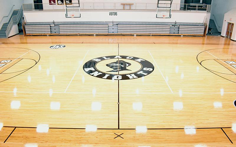 Lights glisten while showcasing the restored floor inside the Robbinsville High School gymnasium. The effort took a mere three weeks to complete. Photo by Kevin Hensley/sports@grahamstar.com