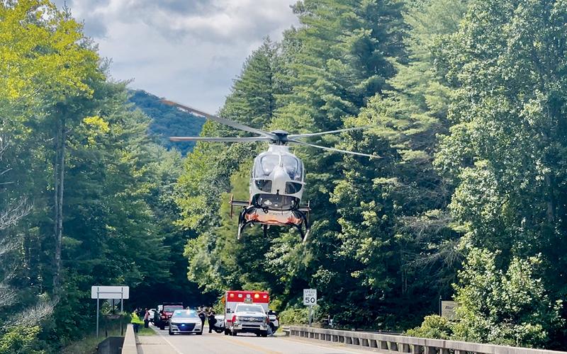 A life-flight helicopter takes off from the West Buffalo Creek bridge – just below the Cherohala Skyway – on Aug. 23, after a motorcycle crash. Photo by Randy Foster/news@grahamstar.com