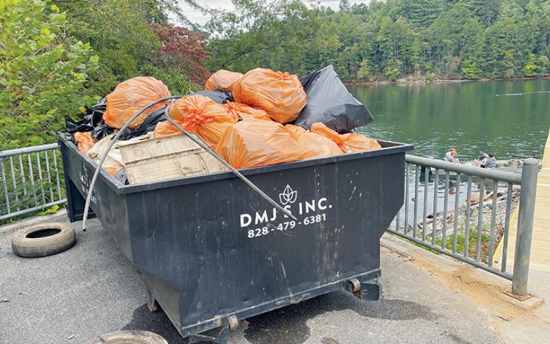 One of two dumpsters sits full on the shores of Lake Santeetlah, following an unload of garbage collected during a community clean-up Saturday. Photos by Randy Foster/news@grahamstar.com