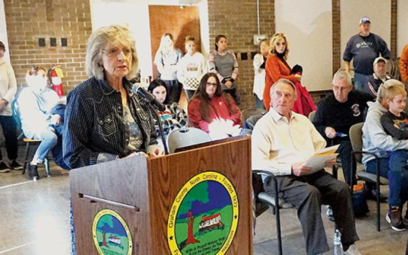 Bonnie Jean Price (behind the podium) addresses the Board of Commissioners at the Oct. 18 meeting, seeking support for a horse riding arena in Graham County. Photo by Randy Foster/news@grahamstar.com