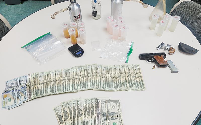 In what is being touted as the biggest drug bust in Graham County’s history, officers seized 900 grams of liquid methamphetamine during a raid late-Friday. Also recovered was a plethora of cash, drug paraphernalia and firearms. Photo courtesy of Graham County Sheriff's Office