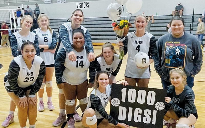 The Robbinsville Lady Knights surprised senior Kensley Phillips with gifts immediately after Oct. 6’s home match against Andrews, to help celebrate Phillips surpassing the 1,000-dig threshold. Surrounding Phillips are (back row, from left): Claire Barlow, Liz Carpenter, Aubrie Wachacha and team manager Eden Orr; (front row, from left): Fala Welch, Tai Owle and Olivia Lewis; kneeling in front, Delaney Brooms (left) and Suri Watty.