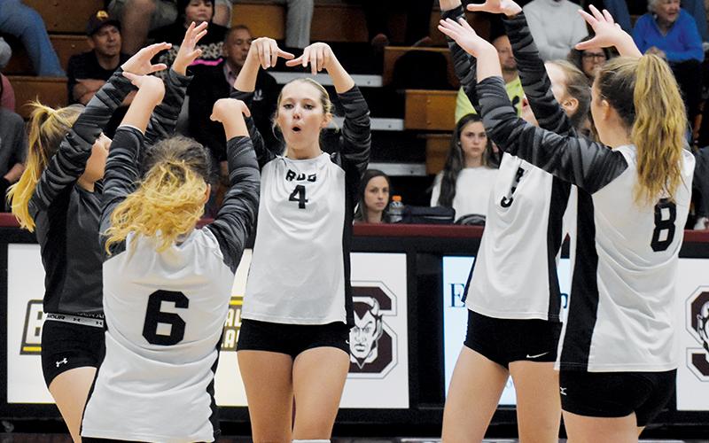 Robbinsville senior Kensley Phillips (4) leads a block celebration Tuesday, in a Smoky Mountain Conference Tournament semifinal match. Phillips is flanked by teammates (clockwise) Claire Barlow, Liz Carpenter, Desta Trammell and Suri Watty. Photo by Justin Fitzgerald/Cherokee Scout
