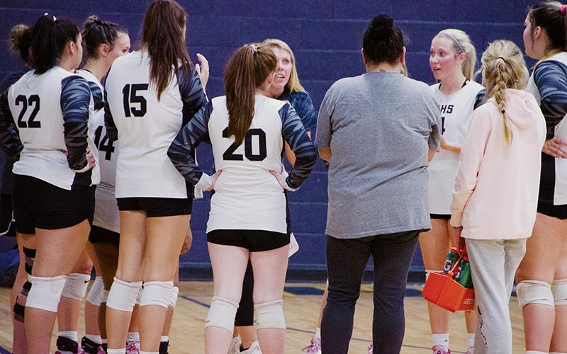 Head coach Kadey Phillips strategizes with the Lady Knights during a fifth-set timeout Tuesday, in the second round of the state playoffs at Highland Tech. Robbinsville fell to the No. 4-seeded Lady Rams, ending its season with 17 wins. Photo by Kevin Hensley/sports@grahamstar.com
