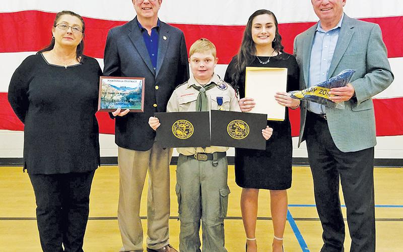 Gentry Trantham (center) received the first-ever Heart of Scouting Award at the 2019 Boy Scouts of America Nantahala District Banquet. Also pictured are (from left) his mother, Lisa Trantham; then-State Rep. Kevin Corbin; his sister, Willow Trantham; and then-N.C. Sen. Jim Davis. Photo by Samantha Sinclair/CNI News Service