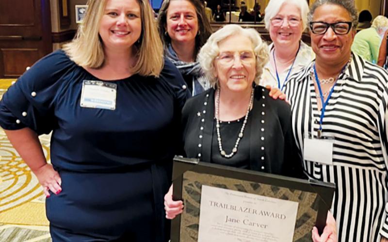 Tri-County Democratic Women member Jane Carver (front, center) had plenty of support when she received the distinguished Trailblazer Award in Greensboro. Front row: Elizabeth Goodwin, Democratic Women of North Carolina President; Carver; and Tri-County Democratic Women President Pat Sherrill. Standing in back are Julia Buckner, a past president of the Democratic Women of North Carolina; and Diane Snyder, Tri-County Democratic Women member.