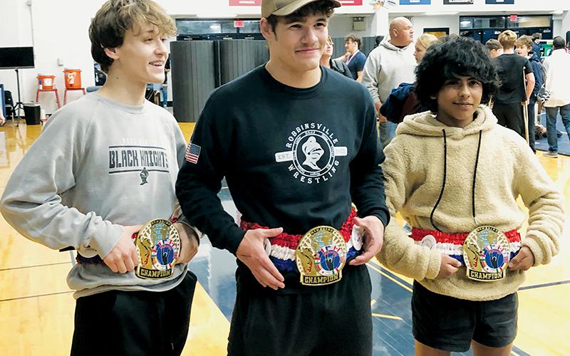 Loxston Hooper, Kage Williams and Adair Panama (from left) sport the championship belts they received for conquering their respective weight classes at the Nov. 23 Jet Invitational. Photo by Kevin Hensley/sports@grahamstar.com