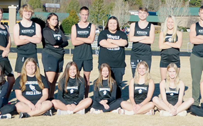 Members of the 2022-23 Robbinsville High School indoor track team. All names are listed from left. Front row: Tia Hall, Naomi Taylor, Kadence Howell, Katie-Lyn Gross, Anna Wehr, Taelyr Jackson, Delaney Brooms and Zoie Shuler. Back row: Colton  Satterfield, Zeb Stewart, Albert Avella, Bruce Helms, Caleb Draper, Fala Welch, William Cable, Eden Orr, Logan Hooper, Kensley Phillips, Donovin Hall, Cooper Adams, Caden Lail and Tytan Teesateskie. Photo by Kevin Hensley/sports@grahamstar.com
