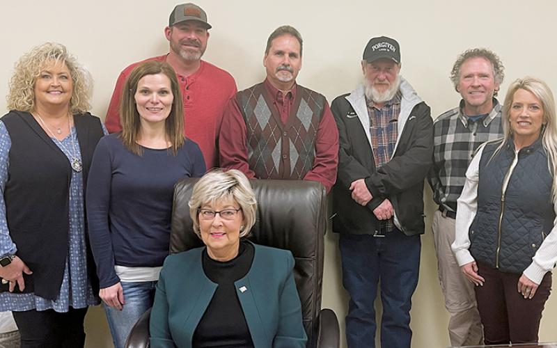 Graham County acting manager Kim Crisp, commissioners Natasha Williams, Jacob Nelms, Connie Orr (seated), Lynn Cody and Keith Eller (from left) appear with Dr. David Booth and his wife Cora Booth (right), following contract negotiations Monday. Photos by Randy Foster/news@grahamstar.com