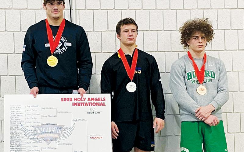 Despite teams from multiple states and classifications, no one could deny Kage  Williams’ (left) pursuit of the 182-pound championship in the 2022 Holy Angels  Invitational. The Black Knights’ standout even knocked off a defending 4A state champion Friday to secure first place.