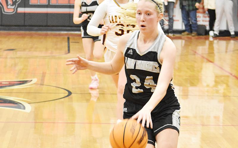 Robbinsville senior Kensley Phillips pulls away on a fast break during overtime of Feb. 16's Smoky Mountain Conference finals against Cherokee. Photo by Kevin Hensley/sports@grahamstar.com