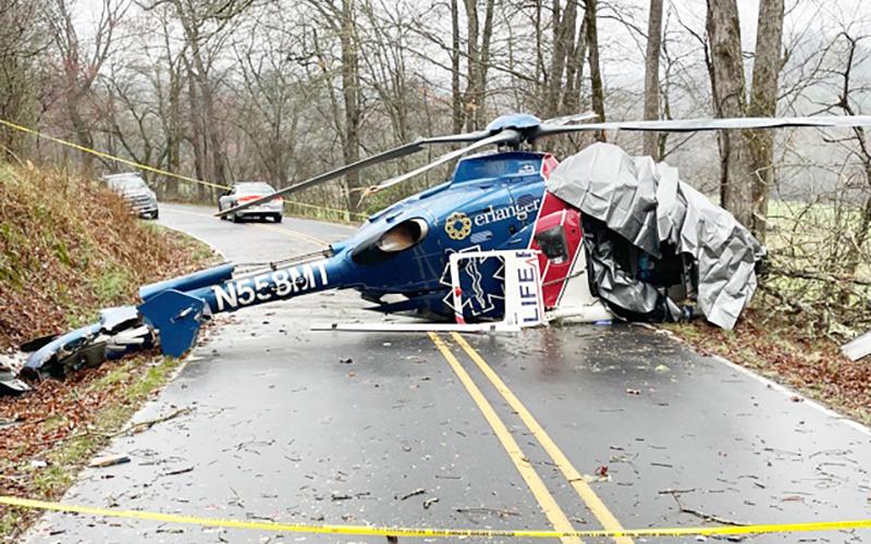 Wreckage of Life Force 6 blocks Middle Burningtown Road in Macon County on Friday on the morning following a crash. All four aboard survived. Photo by Mia Overton/The Franklin Press