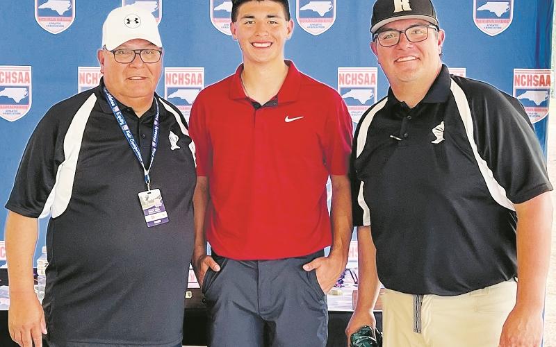 Robbinsville Black Knights sophomore Isaiah Brown stands proudly between his grandfather Jody (left) and Jeremy Brown at the 1A state golf tournament, which was held at Pinehurst No. 6 between May 15-16. It was Brown's inaugural foray into statewide competition.