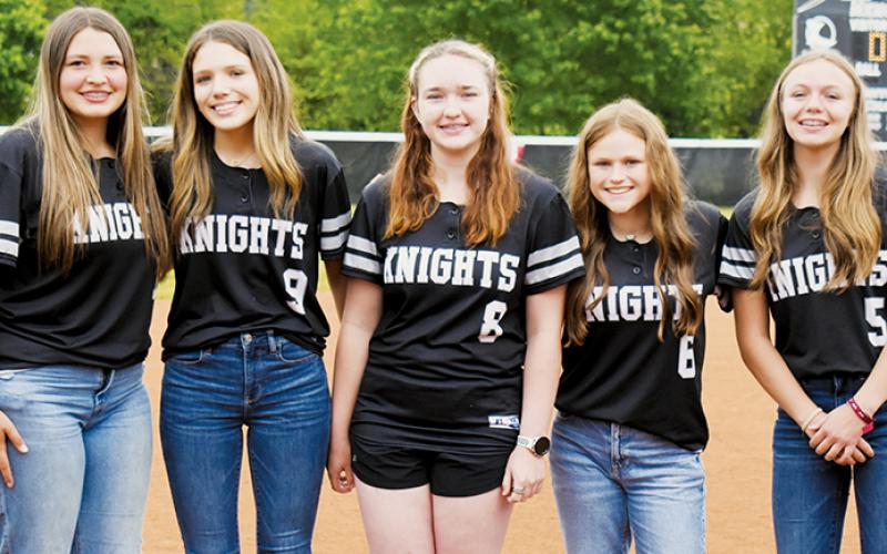 Robbinsville Middle School recognized its 8th-grade softball players May 11, prior to the varsity playoff game against Elkin. From left are Dreylee Webster, Payton Odom, Presley Caylor, Ella Atwell and Sydney Adams.