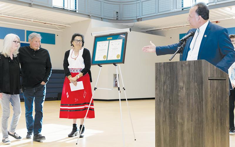 Sharon and David Crowe (far left) gaze in amazement at their respective Order of the Long Leaf Pine awards, which were presented in a surprise ceremony May 3 at the Jacob Cornsilk Community Center. Standing next to the couple is Order of the Long Leaf Pine Board Member; at the podium is N.C. Bureau of Indian Affairs Executive Director Greg Richardson. Photos courtesy of Maria Shook Photography