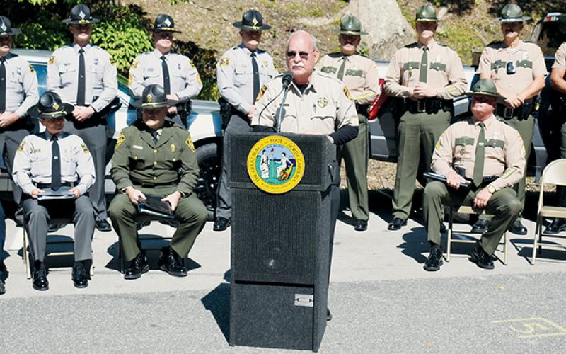 Flanked by officers and representatives from both North Carolina and Tennessee, Swain County Sheriff Curtis Cochran speaks during the “Border to Border” Tail of the Dragon Education Campaign Launch at Deals Gap Motorcycle Resort on June 13. Photos by Kevin Hensley/editor@grahamstar.com