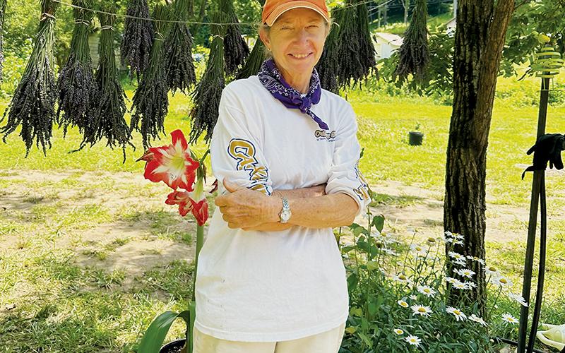 Marie’s Lavender Farm’s Sue Huskey stands proudly in front of a recently-hung crop on the grounds of the Yellow Creek establishment. Photos by Latresa Phillips/The Graham Star