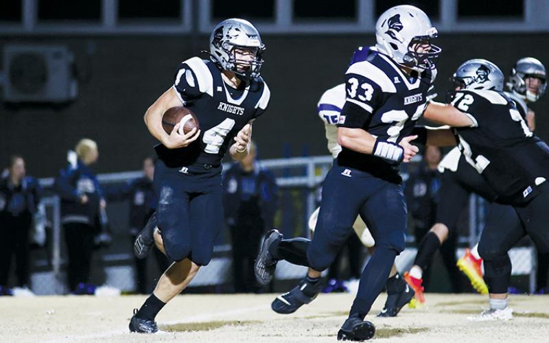 Led by the assurance of fellow classmate Kage Williams (33), Cuttler Adams takes off in the open during the first round of the state playoffs Nov. 3 against Cherryville. Adams has barely pumped the brakes this summer – and the fruits of his labor are already showing. Photos courtesy of Miranda Buchanan/Robbinsville High School Yearbook