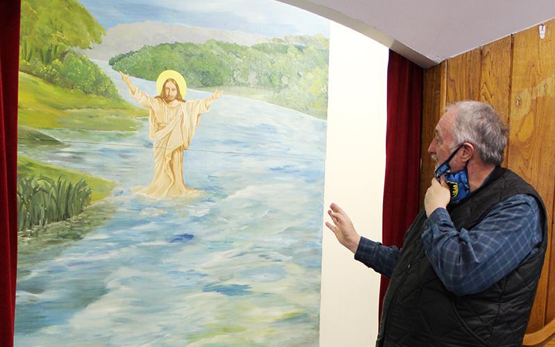 The painting over the baptism pool at Sweetwater Baptist Church is just one of many beautiful pieces of artwork hanging in sanctuaries across Graham County. Photo courtesy of Sydney Varajon/Contributing Photographer