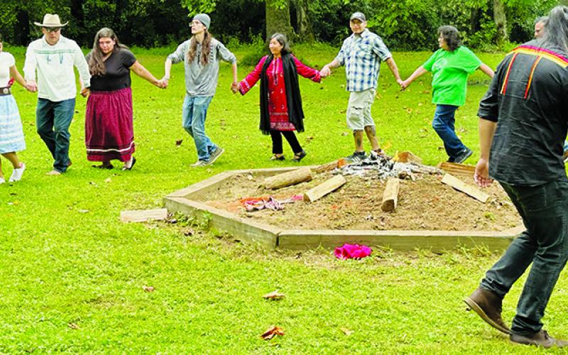 Eastern Band of Cherokee Indians member Bo Taylor leads a friendship dance around the mound at the Little Snowbird campground on Sept. 14. The “Earth Keepers” ceremony drew spectators from various countries across society. Photo by Latresa Phillips/The Graham Star