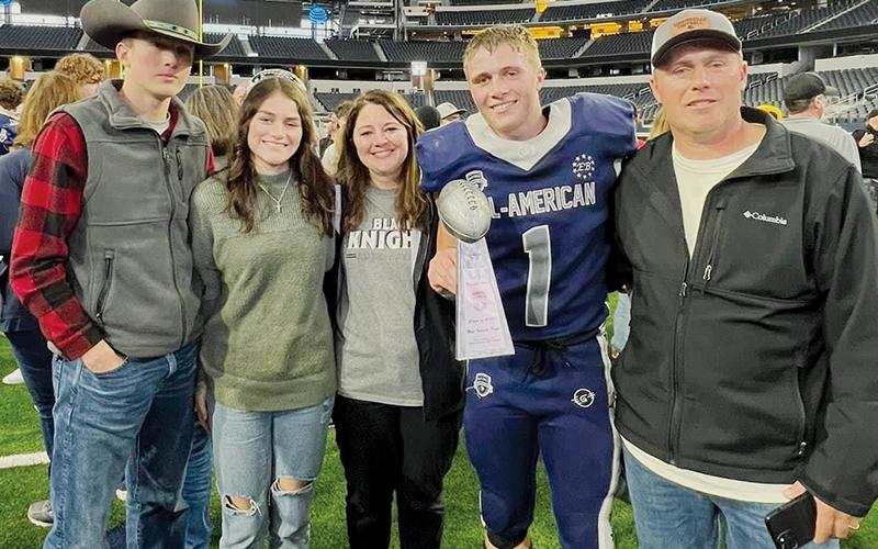 Cuttler Adams scored a touchdown and rushed for over 100 yards in the Jan. 8 Blue/Grey All-American Bowl, which led to the much-heralded running back receiving the game’s MVP award.  Adams is pictured on the field at Cowboys Stadium with his family (from left): Tillman, Chloe, Brandi and Coy Adams.