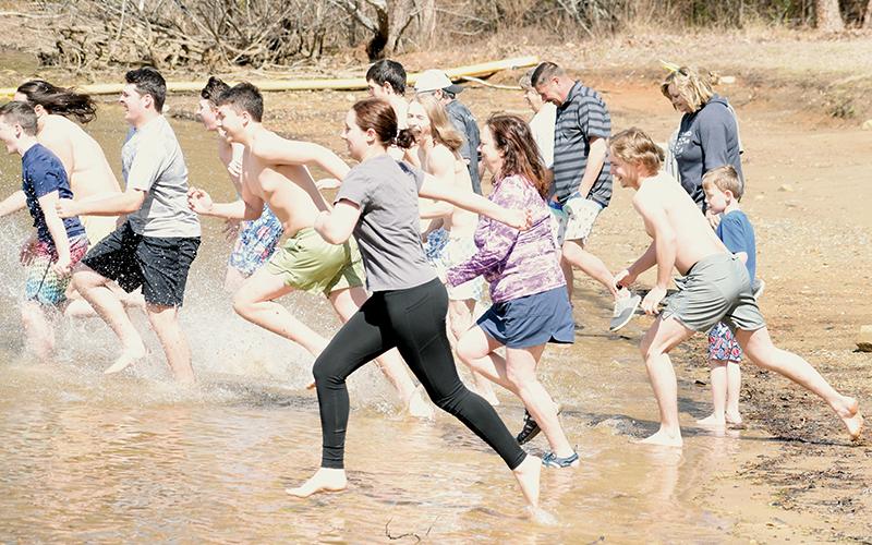 Over 20 participants sprinted full speed into Lake Santeetlah on Saturday, as part of the annual “Polar Plunge.” Photo by Kevin Hensley/editor@grahamstar.com