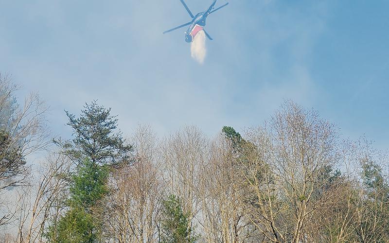 A fire that broke out Sunday afternoon in the Santeetlah area required the use of helicopters to help fight the flames overhead. Photo courtesy of Tory Lynnes/U.S. Forest Service