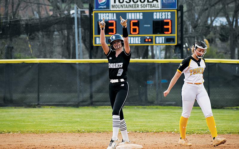 Sydney Adams signals to the dugout after smacking a 2-run, game-tying double Monday at Tuscola. The Lady Knights went on to defeat the Lady Mountaineers, 5-3. Photo by Kevin Hensley/sports@grahamstar.com