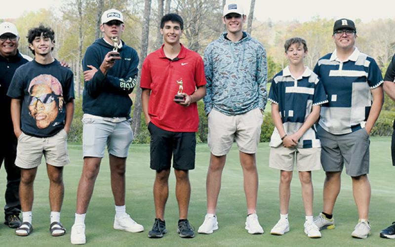 The Black Knights had not won a round of golf against the Murphy Bulldogs since Robbinsville’s last conference title in 2000. That changed Monday, with the team slicing by Murphy in the second round of the annual divisional tournament. From left are Avery Brown, assistant coach Jody Brown, Trey Lambert, Isiac Collins, Isaiah Brown, Nathanael Shope, Cody Crisp, assistant coach Jeremy Brown and head coach Kent Williams. Photo by Kevin Hensley/sports@grahamstar.com