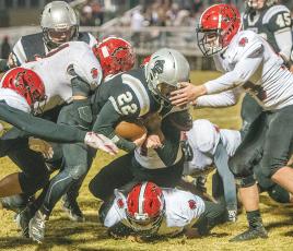 Surrounded by a pack of Wildcats – six to be exact – Robbinsville senior Rylee Anderson trucks ahead during Friday’s 28-7 win over Andrews. Anderson broke the all-time Black Knights rushing record in the fourth quarter of the game. Photo by Byron Housley/The Graham Star