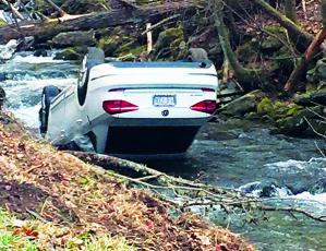 Jason William Burrell’s five-day crime spree ended Wednesday, Jan. 22, when the Volkswagen he had stolen crashed in Bellvie’s Curve on Junaluska Road in Cherokee County. Photo by Robbi Pounds/rpounds@grahamstar.com
