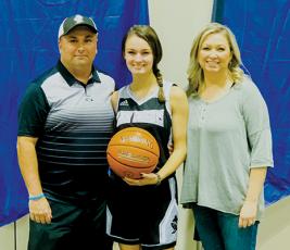 Robbinsville senior Cambrie Lovin scored her 1,000th career point during the KSA tournament in Orlando on Saturday. Lovin is pictured with parents Brandon and Haley, moments after achieving the accomplishment.