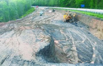 Work is underway to fix an area along U.S. 74 between the Hyatt Creek exit and Bryson City, that has long had cracks in the road and a slow-moving slide. Photo by Terry Greene/Smoky Mountain Times