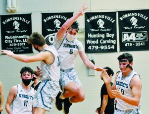 Jeb Shuler, Drey Keener, Nathan Collins and Eddie Brooms (from left) could not contain their excitement after Robbinsville bested Murphy in a 62-60 overtime thriller Tuesday night. Photos by Kevin Hensley/editor@grahamstar.com