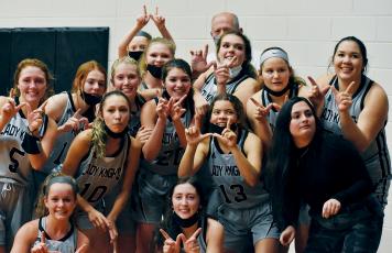 In the moments following Robbinsville’s 67-53 win over Murphy on Tuesday night, it was tough for the Lady Knights to know exactly which camera to look at, as multiple sources attempted to capture the first post-game memory of the victory. Photos by Kevin Hensley/editor@grahamstar.com