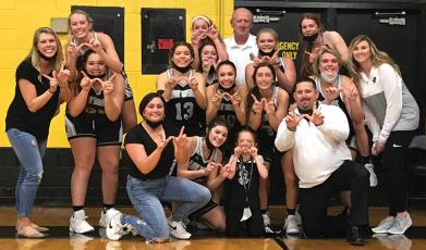 Robbinsville Lady Knight players and staff gather to celebrate the program's first Smoky Mountain Conference title since 2010, clinched tonight with a 67-50 win at Murphy. Photo by Kevin Hensley/editor@grahamstar.com