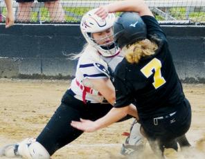 Senior catcher Maggie Knight tags out South Stokes’ Madison Wilson during the May 5 first-round playoff game against the Sauras. Robbinsville fell 3-0, to be eliminated from the postseason. Photo by Art Miller/amiller@grahamstar.com
