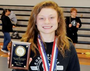 Aynsley Fink was all smiles June 10, moments after being named the Most Valuable Wrestler of the 2020-21 Smoky Mountain Conference Tournament. Fink became the first female to win a Smoky Mountain Conference tournament championship. Photo by Art Miller/amiller@grahamstar.com